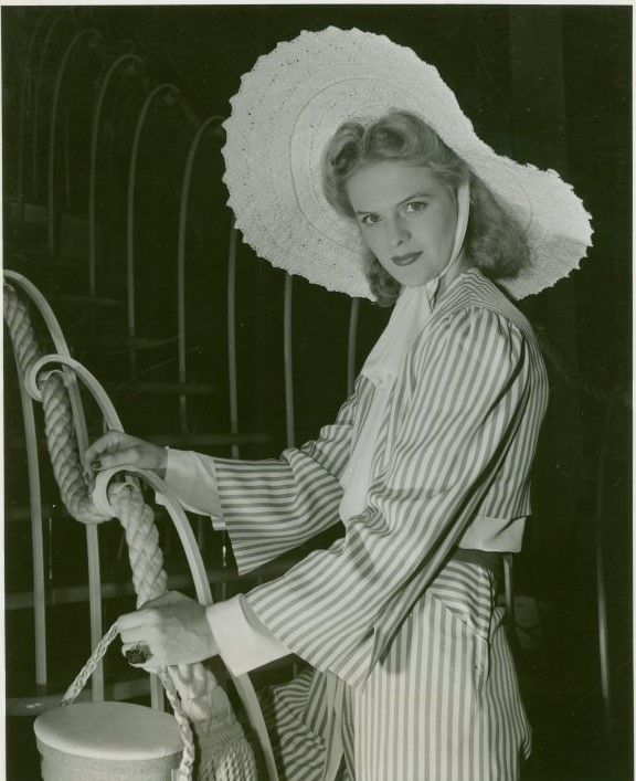 1940s Fashion: large beach hat matched with a rayon suit as seen at the World of Fashion 1940 New York City World's Fair. 