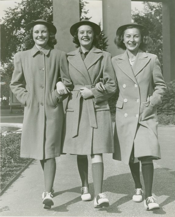 1940s fashion as seen in a 1940 vintage photo from the World of Fashion at the 1940 New York City World's Fair-Girls School Girl coats with saddle shoes.