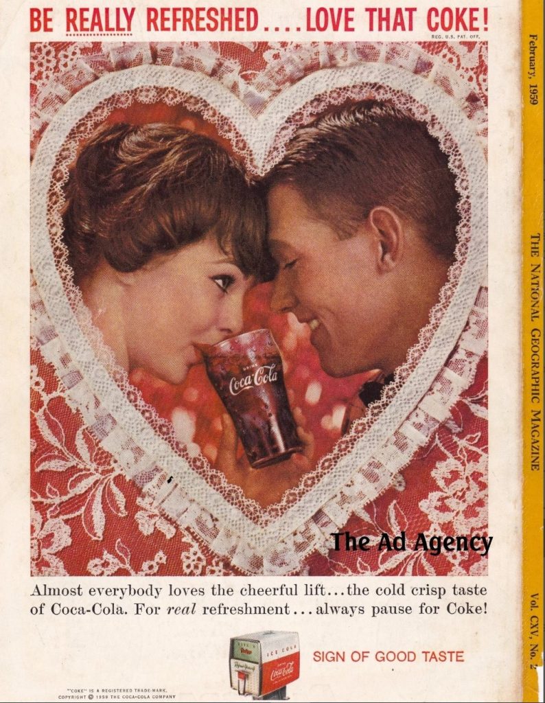 1950s vintage ad for Coca-Cola., Valentines Day featuring a couple sharing a coke inside a giant heart, as seen in February 1959 National Geographic Magazoine