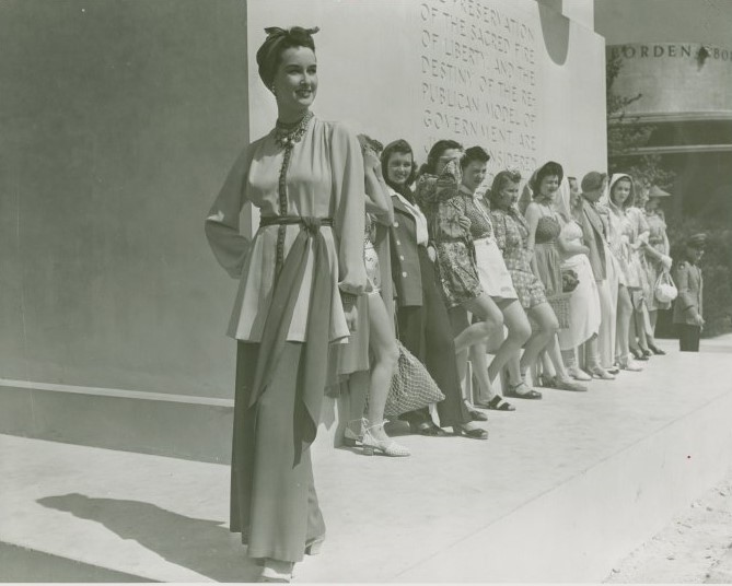 Models in front of the George Washington statue modeling what looks like summer / beach fashions. Early 1940s fashions: As seen at the World of Fashion Exhibit at the 1939/1940 New York City World's Fair. 