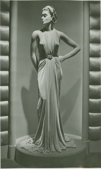 Late 1930s fashion: velvet gown on a mannequin at the Hall of Fashion exhibit at the 1939 New York City Worlds Fair. Designed by Bonwit Teller. It is a pale beige copper colour.