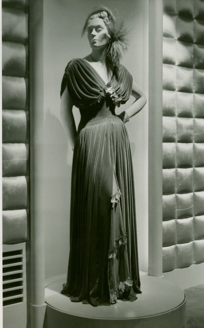 Late 1930s fashion: velvet gown on a mannequin at the Hall of Fashion exhibit at the 1939 New York City Worlds Fair. Designed by Henri Bendel. It is a warm, rich copper velvet.