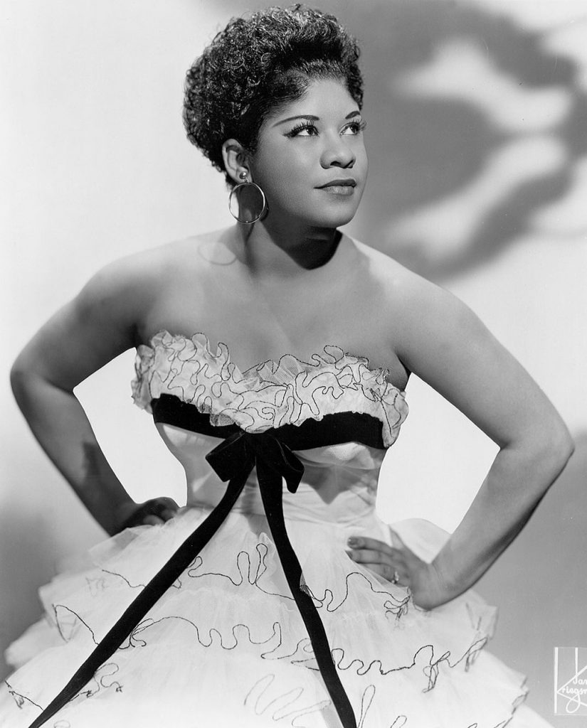 1950s vintage photo of R&B Singer, Ruth Brown in 1955 in a beautiful 1950s dress. 