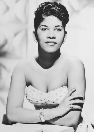 1950s vintage photo of R&B Singer, Ruth Brown in a 1950s Dress posing for a publicity photo. 