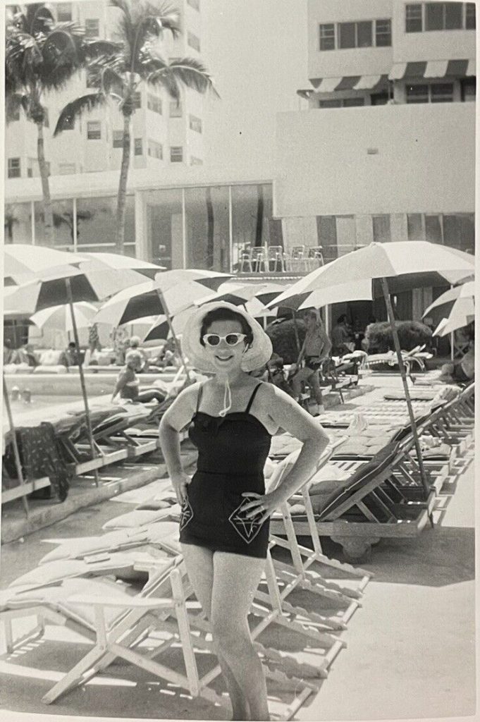 1950s vintage photo of a woman in a 1950s bathing suit posing at her Florida hotel pool -vintage vacation photo & 1950s fashion