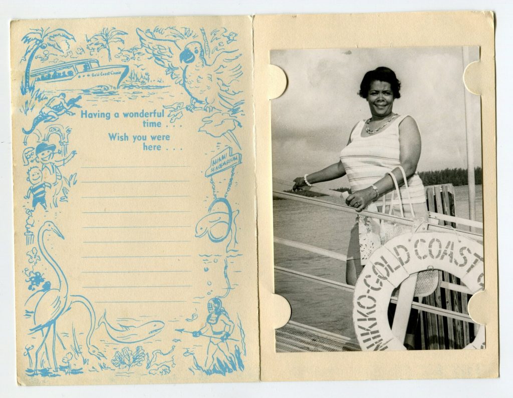 1960s vintage souvenir photo for Gold Coast Cruises featuring an image of a Black Woman happily posing on the boat while on vacation. Fun vintage vacation photo.