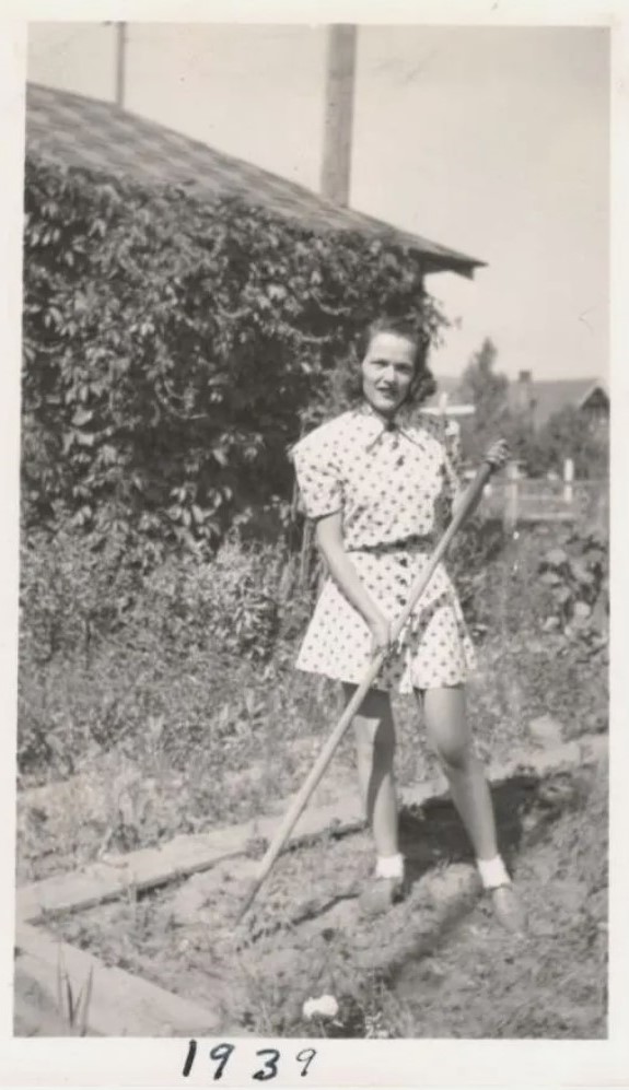 1930s vintage photo of a woman in 1939 Gardening In a Summer playsuit. 