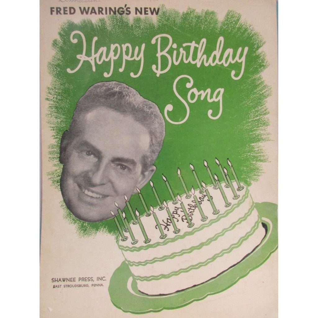 1950s sheet music for Happy Birthday Song from Fred Waring featuring an illustration of a birthday cake. The sheet music is for piano, guitar & vocal.