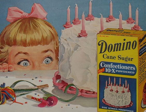 1950s vintage ad for Domino Sugar featuring an illustration of a little girl looking at a big frosted birthday cake.