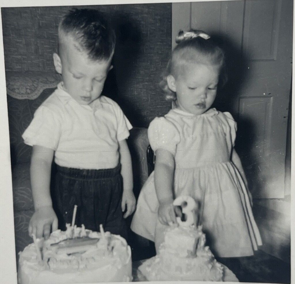 1950s vintage photo of a boys and girls birthday cakes for the age of 3 from 1959. Adorable twins!