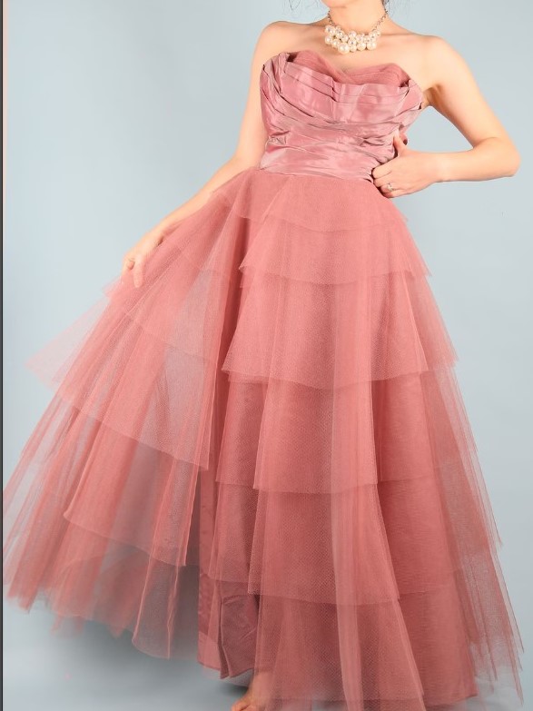 1950s Fashion: Fred Perlberg 1950s Prom Dress / Evening Gown in Taffeta (this one is dusty pink & sky blue (which can be seen in certain light) and tiered netting with a bodice that is boned and gathered. 