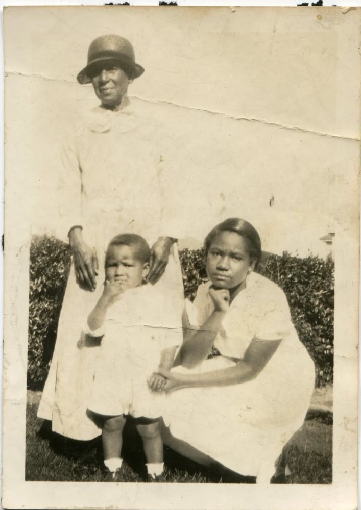 1920s vintage photo of Three Generations of family featuring a Black mother, young son and her mother. 