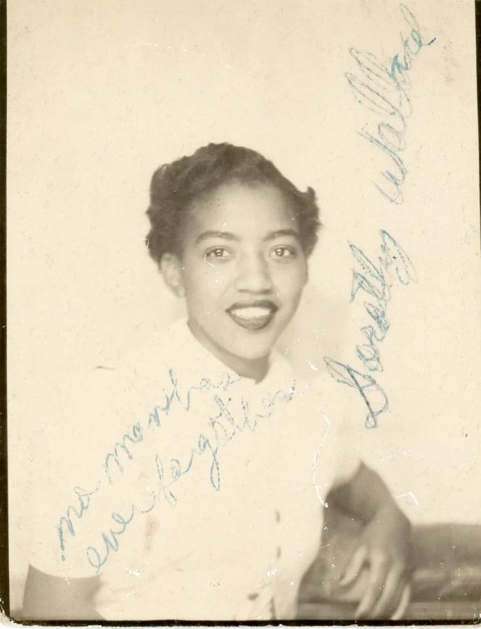 1950s vintage photo of a beautiful young Black Women named Dorothy Wallace. She is wearing a cute short 1950s hairstyle. Fantastic vintage hair inspiration.