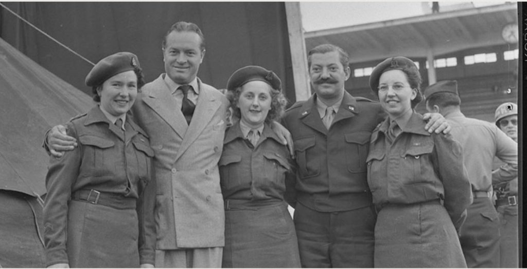 1940s vintage photo: July 24th, 1945: Bob Hope poses with Canadian Nursing Sisters (and a man from his show) at his Bob Hope Show Tour. 