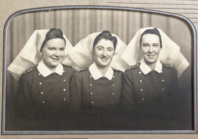 1940s vintage photo of 3 young Canadian Nurses posing together in their nurses uniforms during WW2. Image from Elinor Florence. 