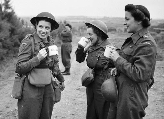 1940s vintage photo: Nursing sisters of No.10 Canadian General Hospital, Royal Canadian Army Medical Corps (R.C.A.M.C.), having a cup of tea upon arriving at Arromanches, France, 23 July 1944