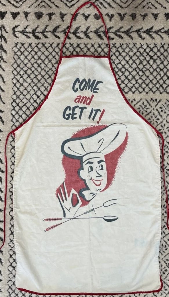 1950’s MCM vintage "Come And Get It" Barbeque Apron featuring a Chef with a Barbecue tool