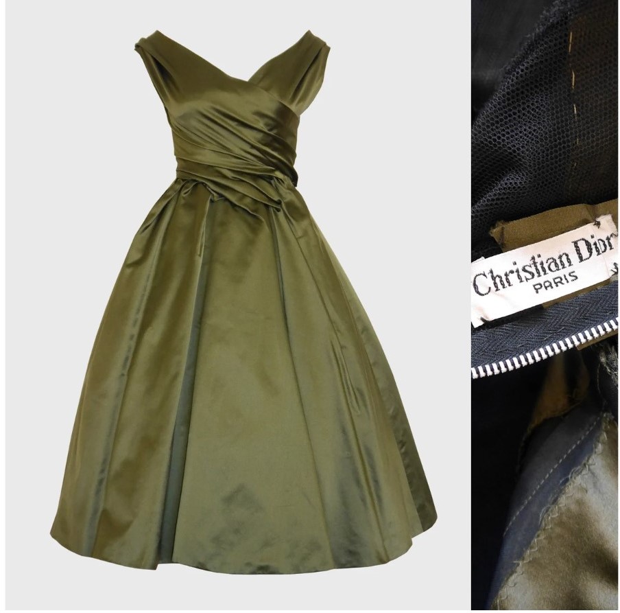 1950s Fashion: Christian Dior Haute Couture dress from Fall 1957 was given the name "Venezuela" by the designer and is crafted from an olive green silk. The dress has substantial weight and features a divinely draped bodice and a very full skirt