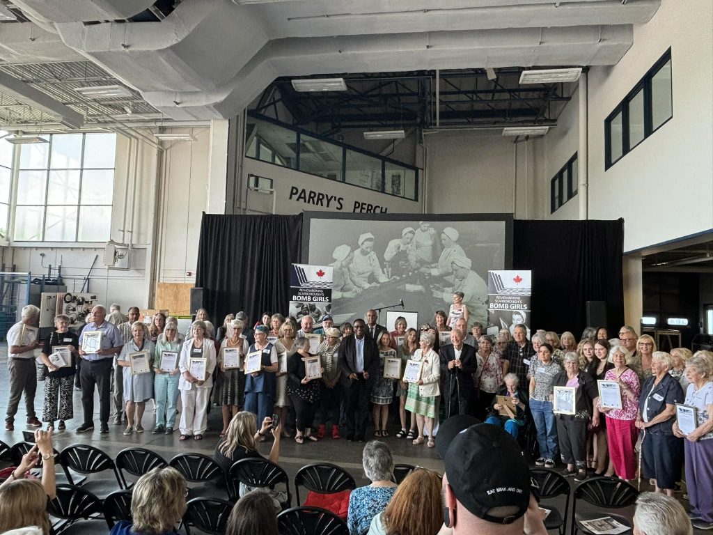 This is the families of some of the Canadian women and men who worked at the GECO plant making ammunition during WW2. There is even ONE ORIGINAL BOMB GIRL in the front row (in the wheelchair).