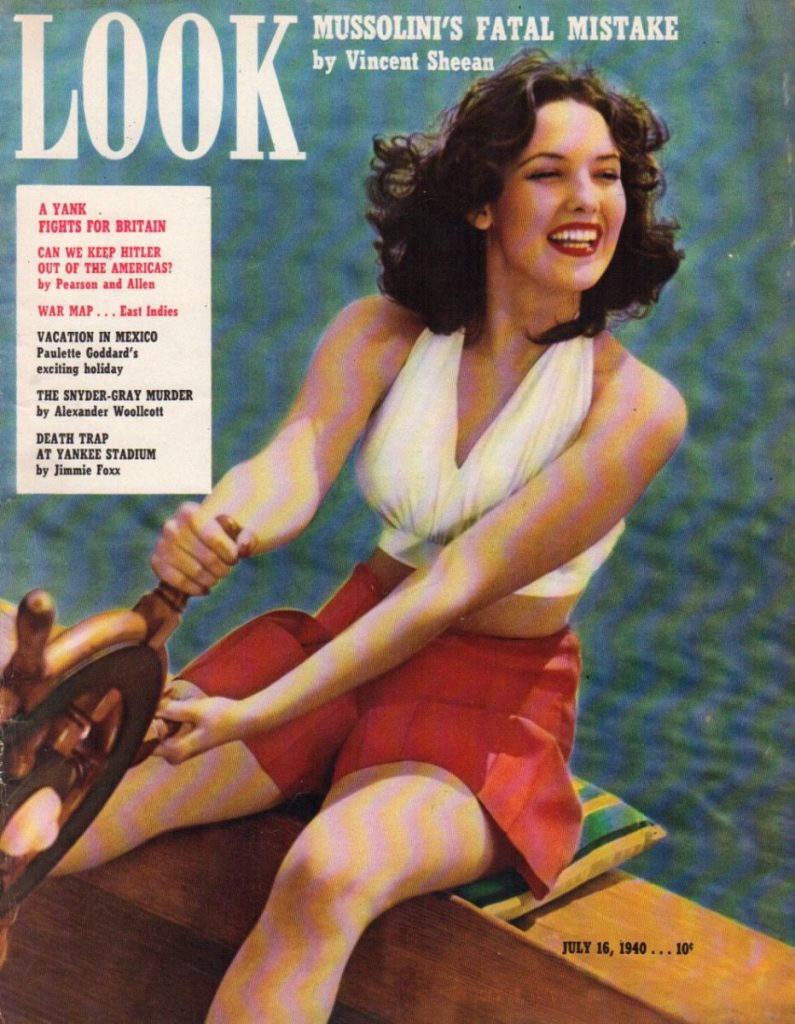 1940s vintage magazine cover July 16th, 1940 LOOK Magazine featuring Linda Darnell on a Sailboat. Linda is wearing 1940s summer fashions. 