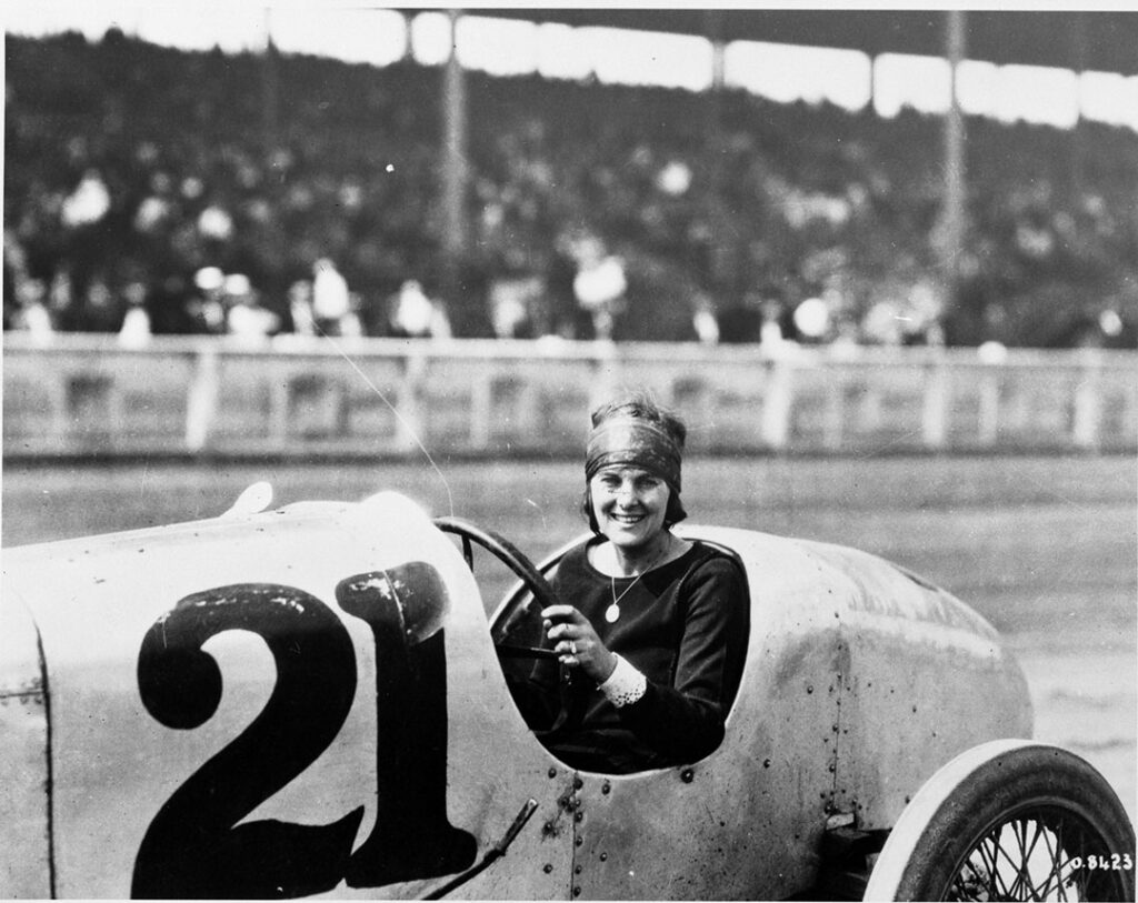 1920s vintage photo at the CNE (Canadian National Exhibition in Toronto) featuring a woman in a race car. It is believed to possibly be Elfrieda Mais a female race car / stunt driver you have never heard of. 