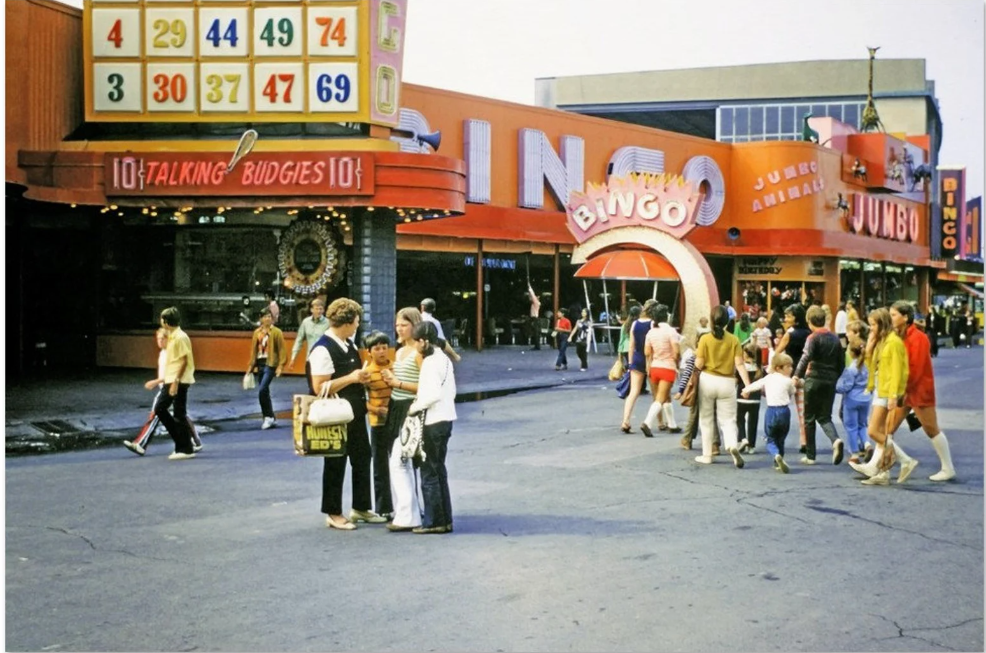 1960s / 1970s vintage photo of Toronto's CNE-Canadian National Exhibition featuring an image of people standing outside of the Bingo Buidling. 