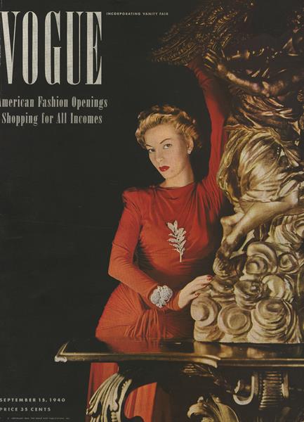 1940s vintage magazine cover: Vogue September 19th, 1940 featuring a woman in an Orange Evening gown. The cover gives off Fall vibes. 