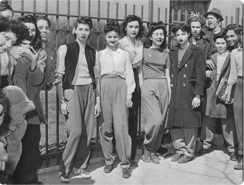 1940s vintage photo of women Protesting the high school dress code that banned slacks for girls, Brooklyn c.1940. Fantastic 1940s hairstyles and 1940s fashions! 