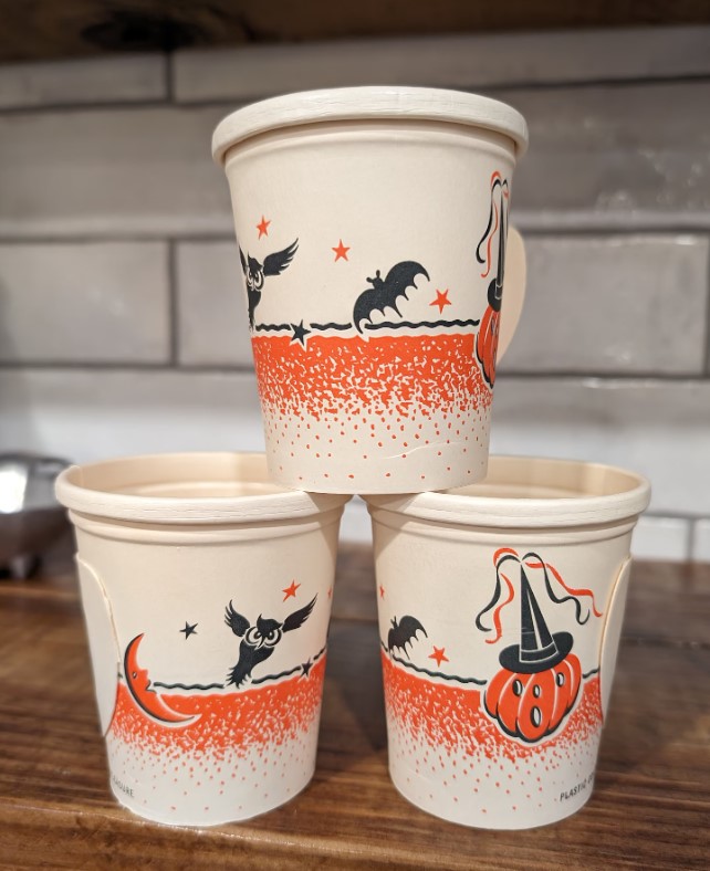 1940s Vintage Halloween Art: paper cups with Halloween illustrations of bats, owls, moon and pumpkin with a witches hat