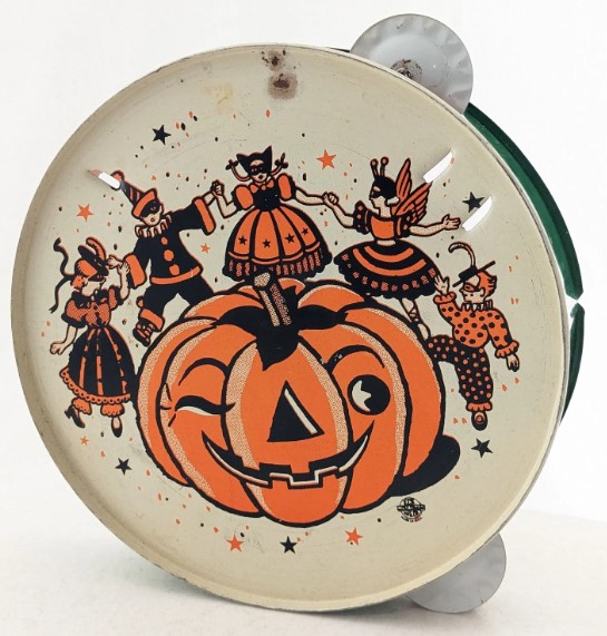 1950s Vintage Halloween:  A 1950's US Metal Toy Mfg. Co. Halloween tambourine noisemaker featuring a Halloween illustration of a pumpkin with kids in Halloween costumes dance around it