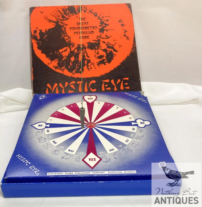 Vintage Halloween: 1950s / 1960s Modern Mystic Eye Pendulum Game. Just ask the Mystic Eye a question and your answer will appear! Made by Clark Publishing Co.