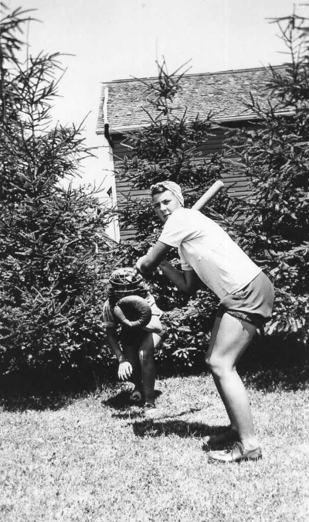 1940s Photo of a young women playing softball during WW2 while working on Ontario farms helping the war effort. They were called Farmerettes. 