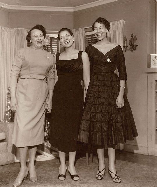 1950s Vintage Photo of 3 Stylish Black Women in 1950s Dresses, 1950s shoes and Christmas Brooches /Pins smiling in front of the Christmas tree. Vintage Black Glamour. 