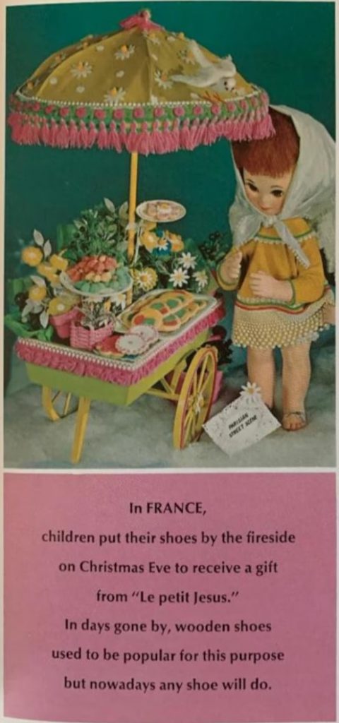 Vintage Christmas Tradition in France as seen in a 1967 - Soft cover - Wisconsin Electric Power Co. "Christmas Cooky Book" featuring 40 pages of fantastic Mid-Century baking recipe. The image features dolls angel at a cart with food and flowers. 